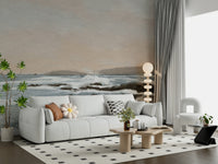 Coastal Hues wallpaper mural of a calm grey-blue seascape behind a white sofa with a daisy cushion in a living room