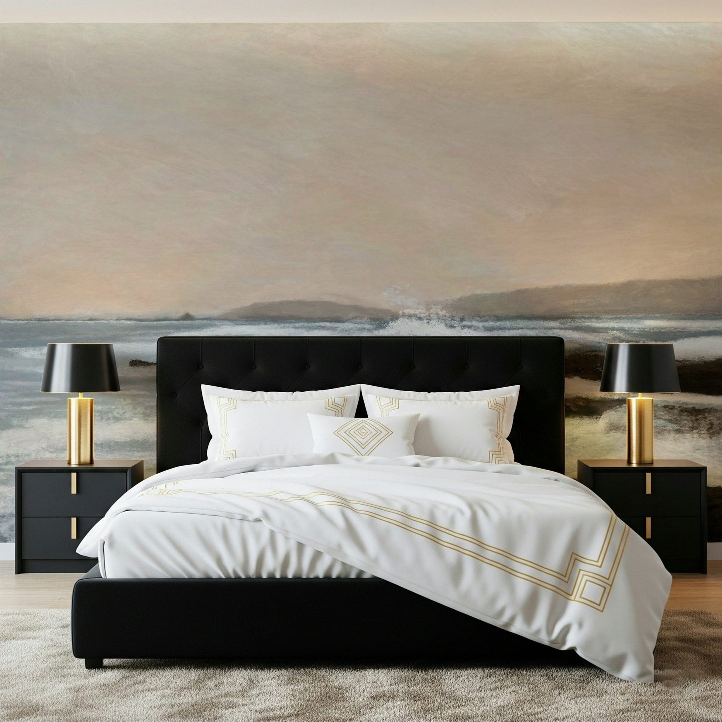 Coastal Hues wallpaper mural of a calm shore behind a black headboard bed with gold-trim bedding in a bedroom