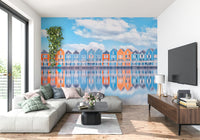 Coastal cottage row mural showing aqua and orange houses by the water