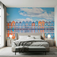 Aqua cottage row wall mural with colorful waterfront houses and calm water reflection