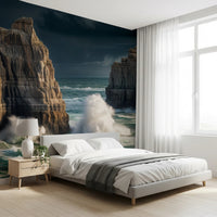 Coastal Giants wallpaper mural behind a low white platform bed with a wood nightstand in a bedroom