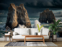Coastal Giants wallpaper mural behind a white wood-frame sofa with a striped rug and tall potted plant