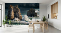 Coastal Giants wallpaper mural behind a wood dining table and wishbone chairs by a white kitchen