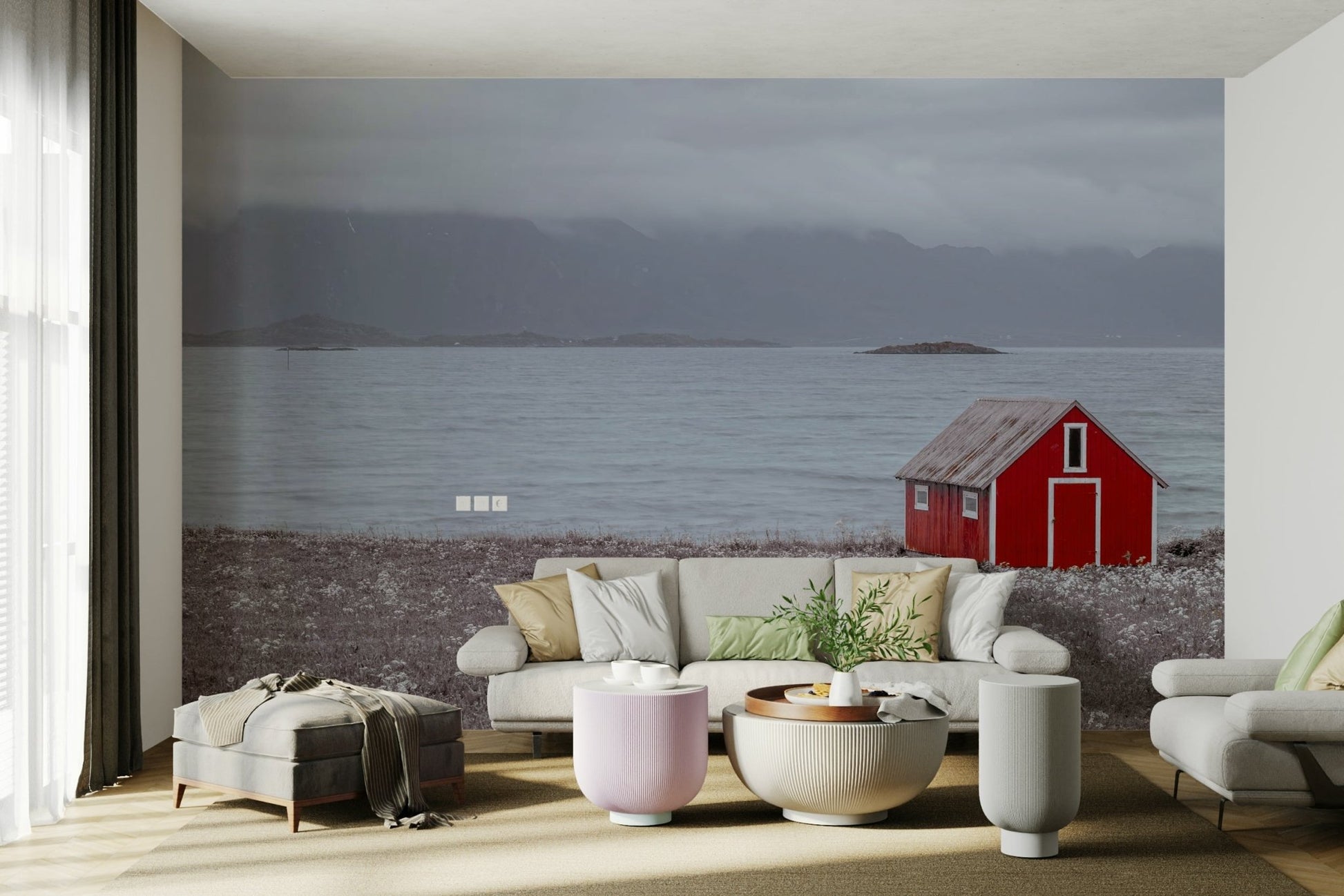 Red cabin by the sea wall mural with majestic mountain views.

