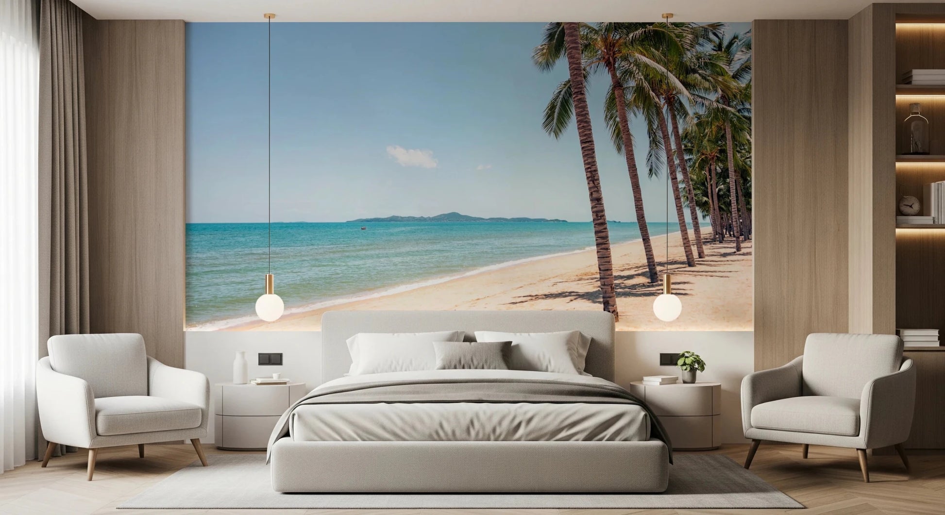 Coastal Palm Serenity wallpaper mural of beach and palms above a gray bed framed by two armchairs in a bedroom