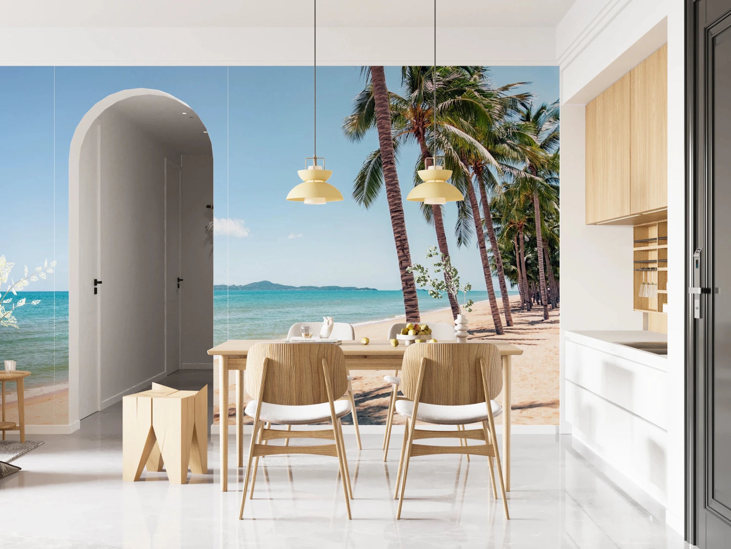 Coastal Palm Serenity wallpaper mural of sea and palms by a wood dining table and arched doorway in an open kitchen