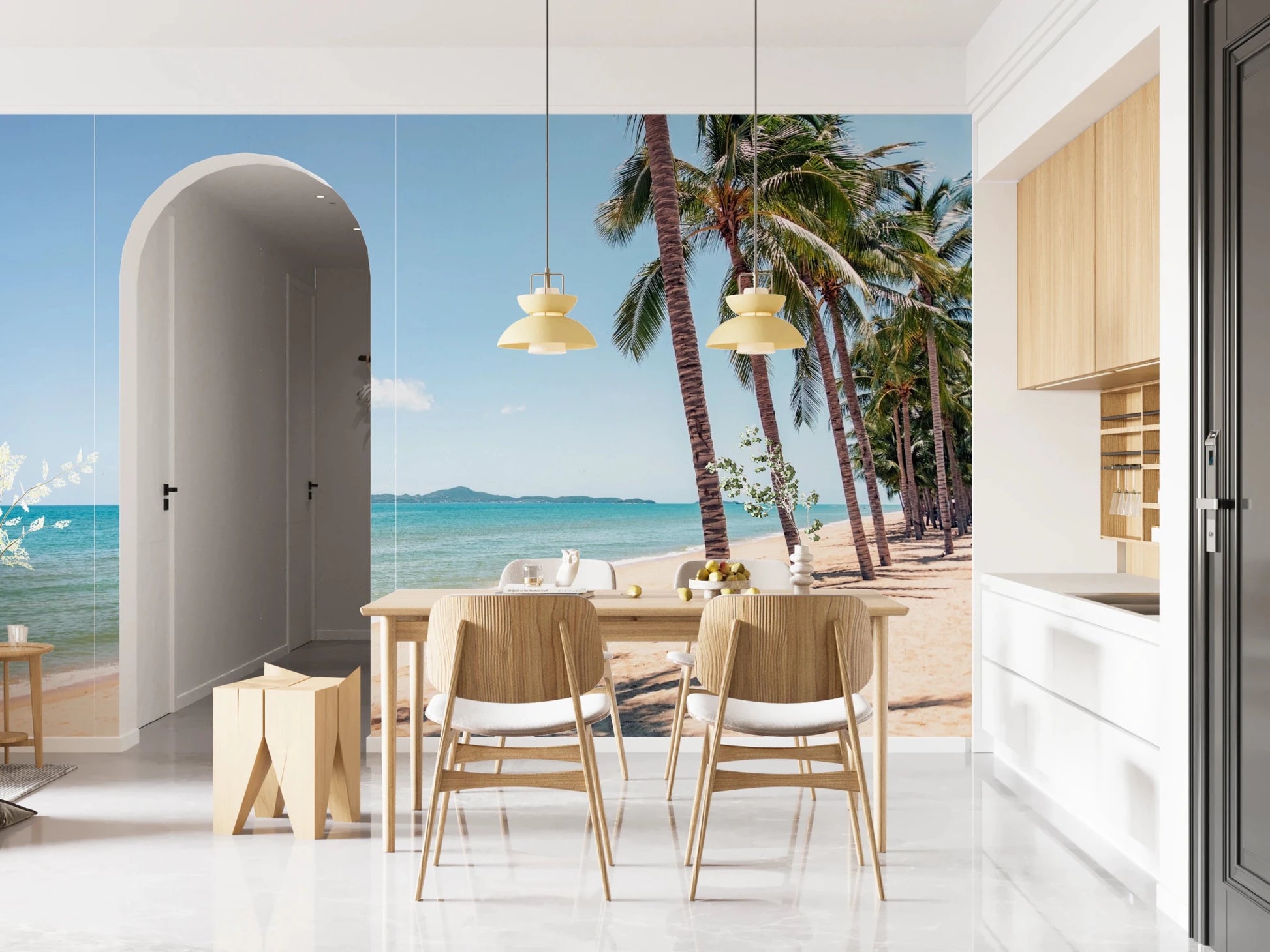 Coastal Palm Serenity wallpaper mural of sea and palms by a wood dining table and arched doorway in an open kitchen