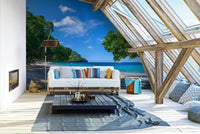 Panoramic view of a tropical beach with palm trees.

