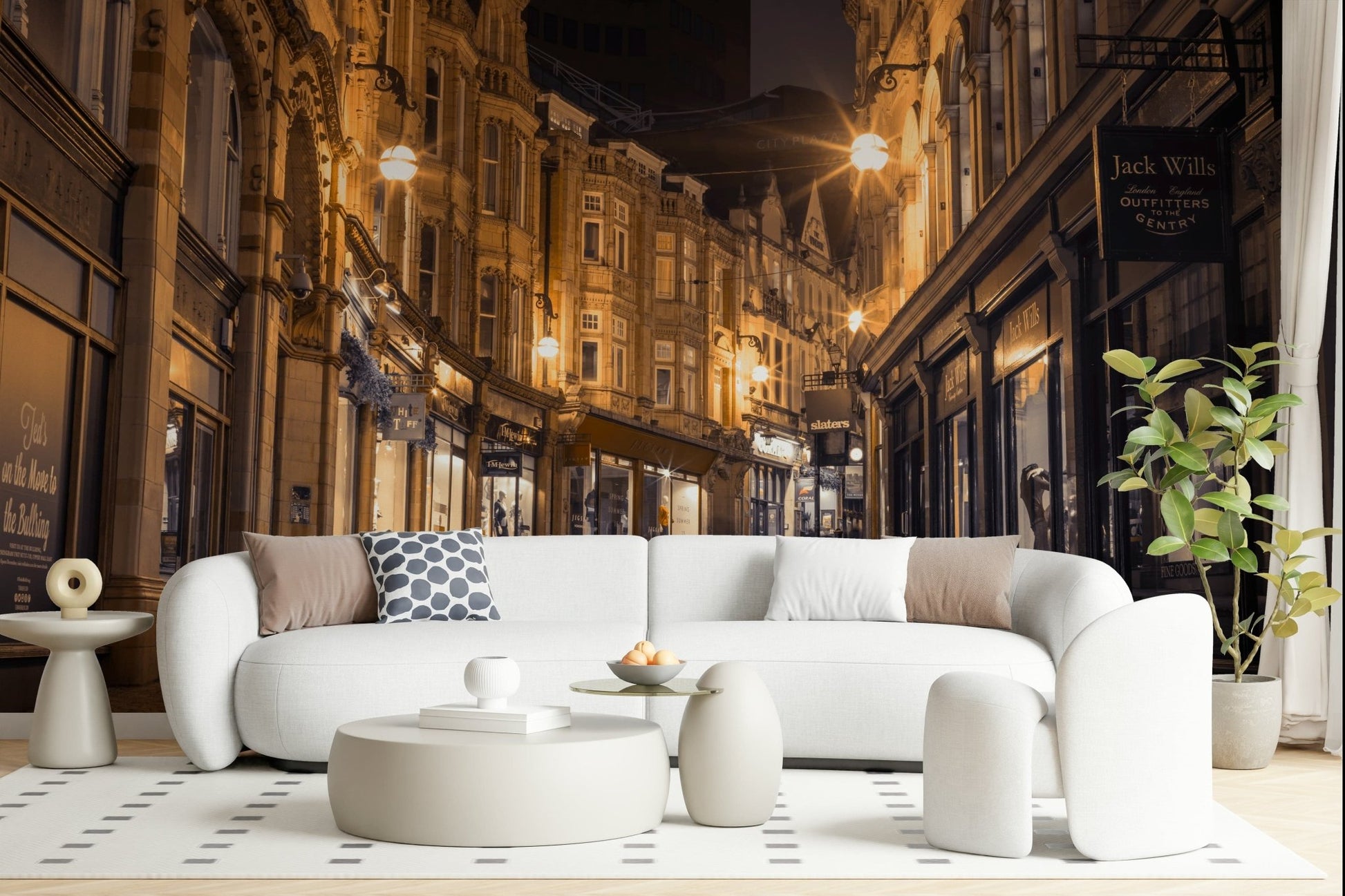 Cobblestone Street Nights wallpaper mural behind a curved white boucle sofa in a bright living room