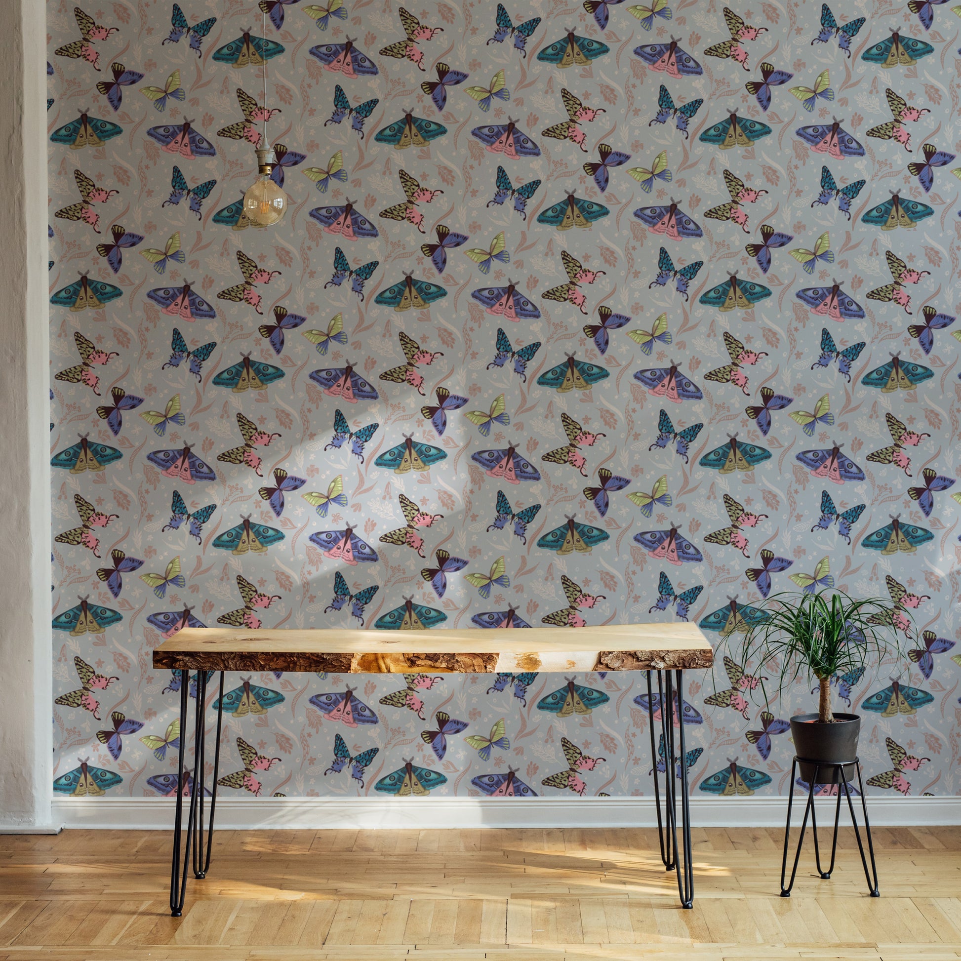 Home office with a premium butterfly pattern wallpaper mural creating a cheerful and whimsical creative environment.
