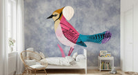 Colorful Jay wall mural, a pink and blue bird on blue-grey behind a rattan chair and bed in a kids room