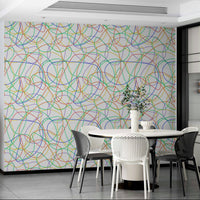 Modern nursery featuring soft pastel line patterns on a focal wall.