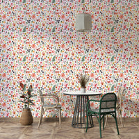 Lush green leaves on a bright coral wallpaper base

