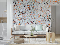 Crisp Light Coral Terrazzo mural scattered elements grey orange dark chips surface.