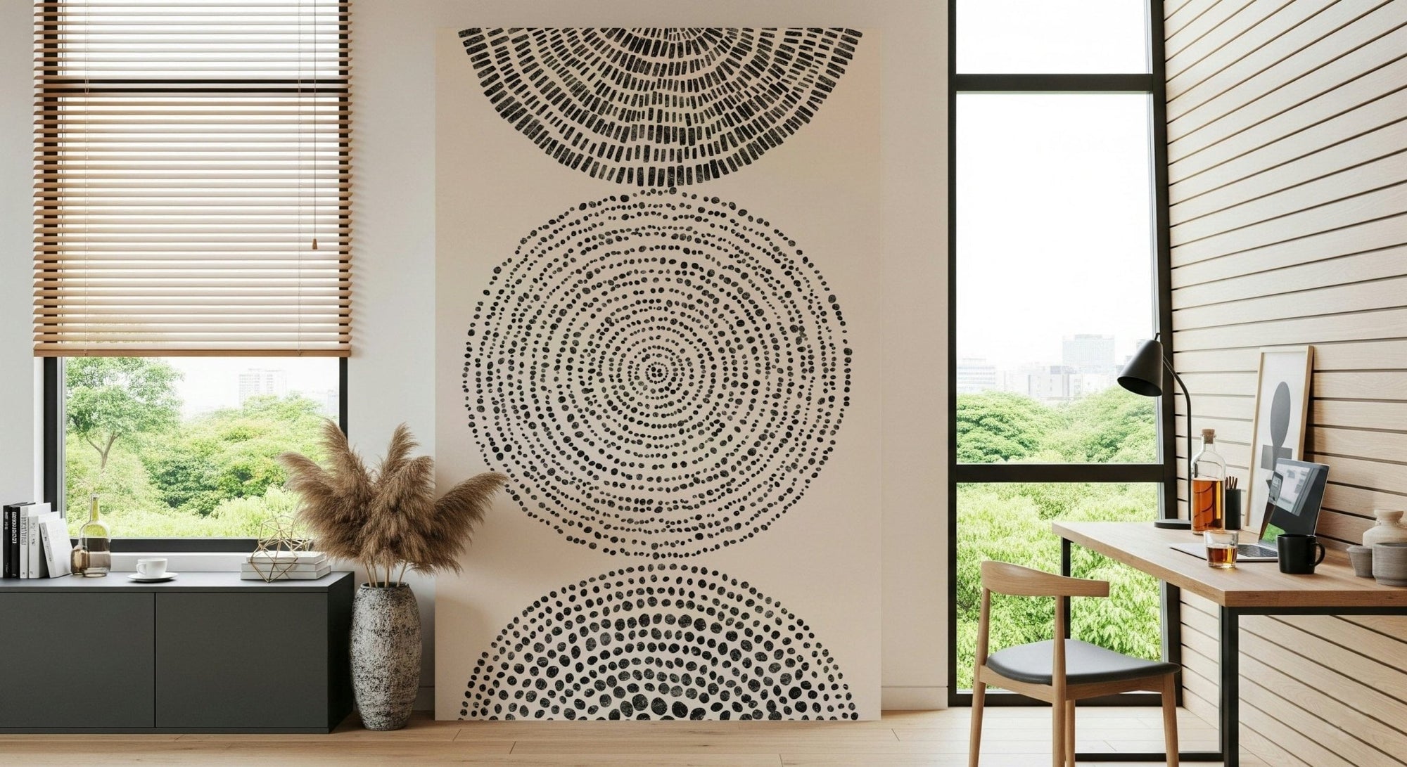 Cosmic Echoes mural of stacked black dotted circles on cream in a home office with desk and pampas