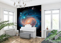 Cosmic Symphony wallpaper mural of a spiral galaxy behind a white piano with sheet music in a bright living room