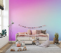 Cotton Candy Pastel Gradient wallpaper mural in pink and aqua in a kids room with a white daybed and plush toys