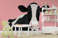 An elegant wall mural with a cow motif.