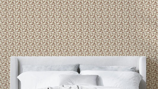 Cozy Cream Lotus Flowers wallpaper in tan ditsy floral behind a gray upholstered headboard and white bedding