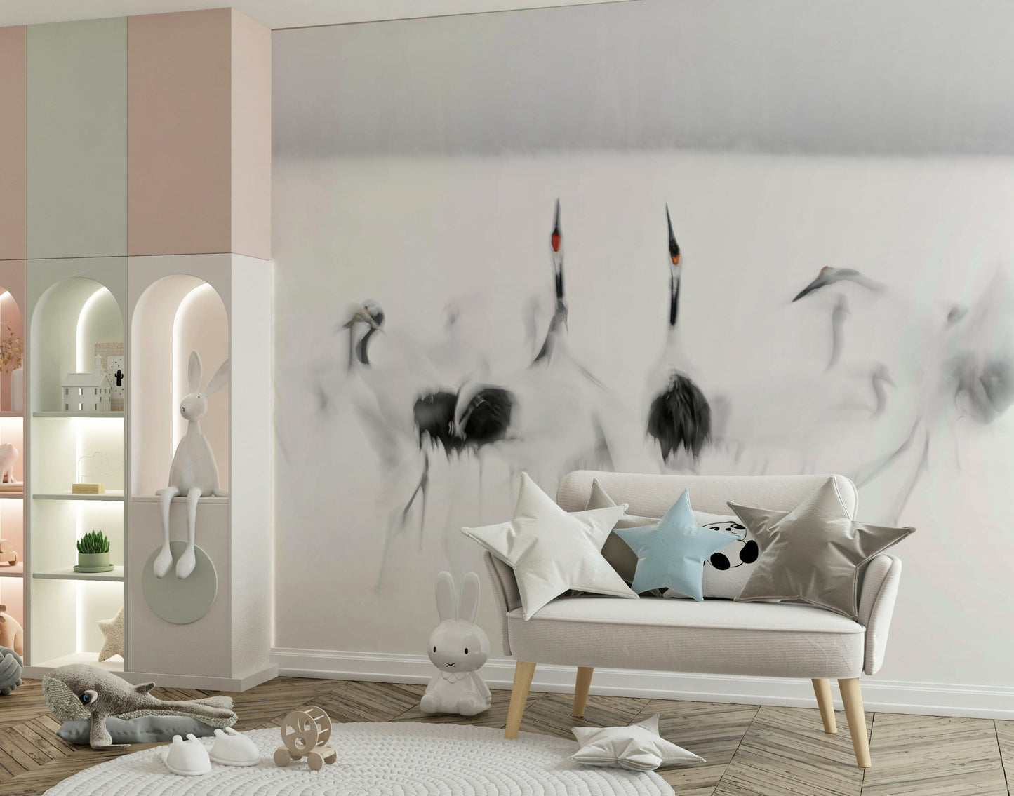 Crane Dance in White wallpaper mural of red-crowned cranes behind a cream loveseat with star pillows in a nursery