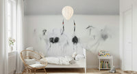 Crane Dance in White wallpaper mural of soft cranes behind a white daybed under a balloon pendant in a kids room