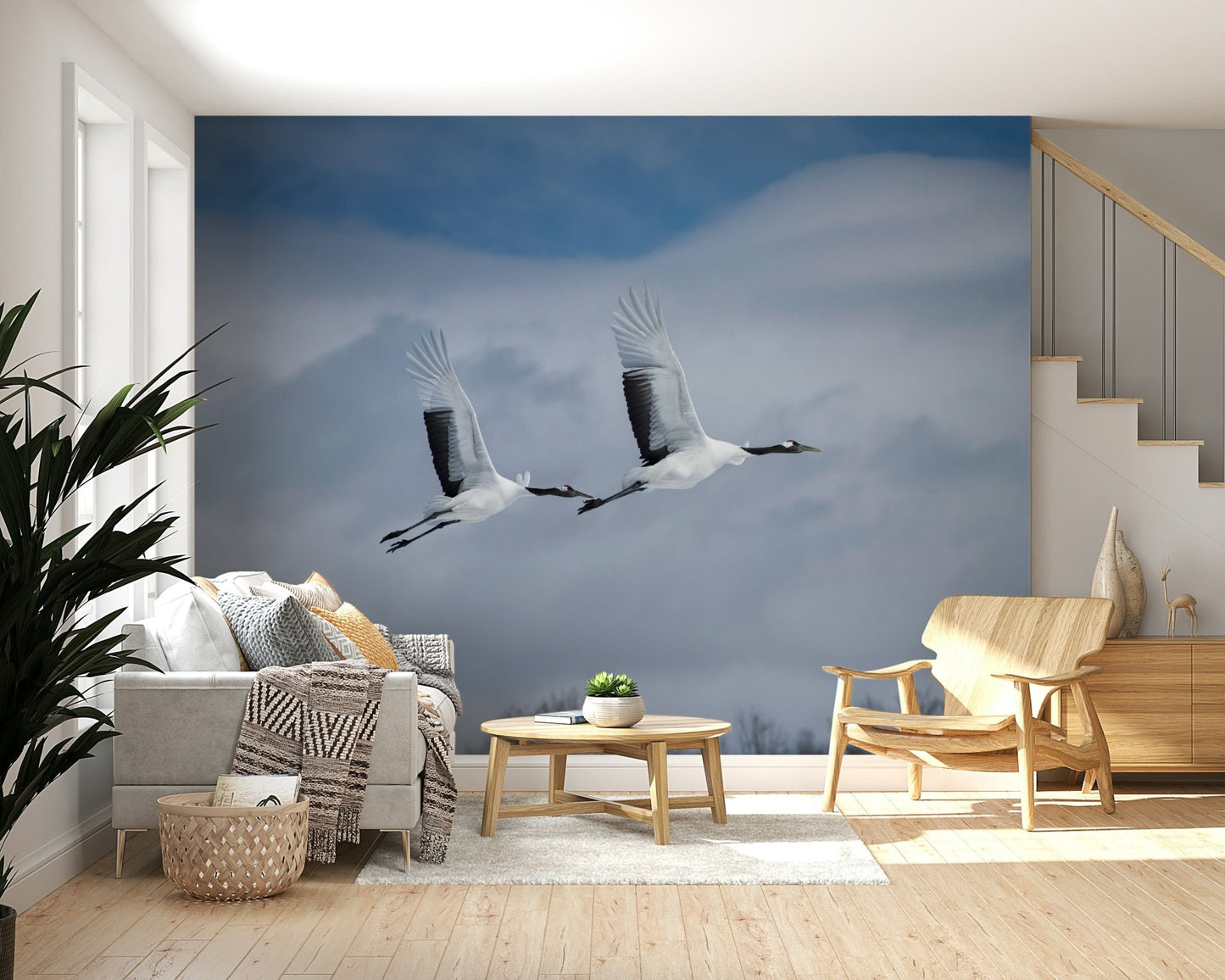 Bedroom wallpaper mural with cranes in flight, calm sky tones, modern apartment style