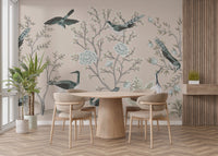 Cream Color Crane Birds on the Vintage Tree wallpaper mural with teal birds behind a round wood dining table