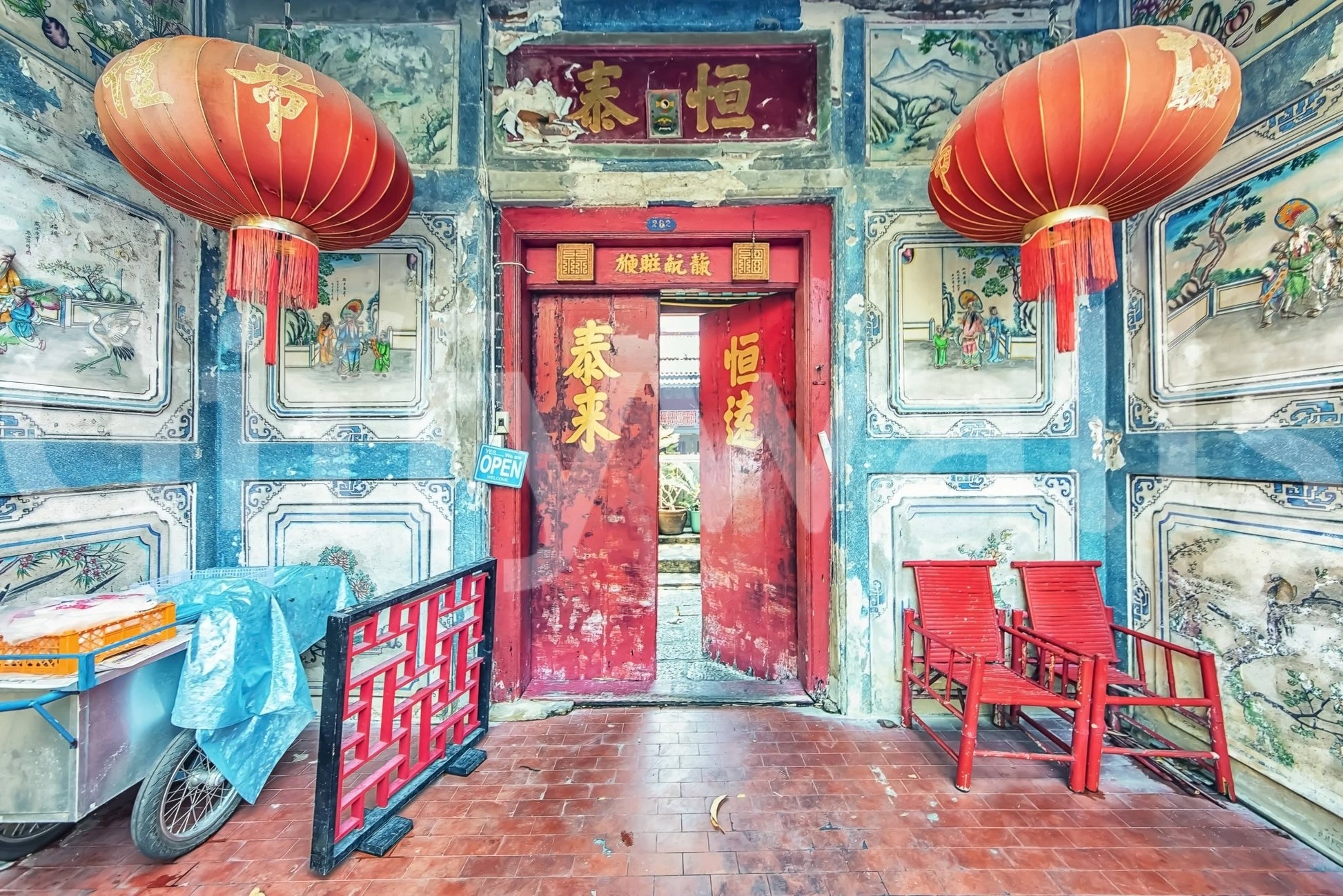 Crimson Lanterns wall mural illustrating textured teal masonry.