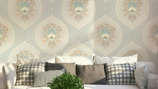 Curved Lines & Blooms wallpaper behind a cream sofa with plaid and grey pillows in a sunny living room