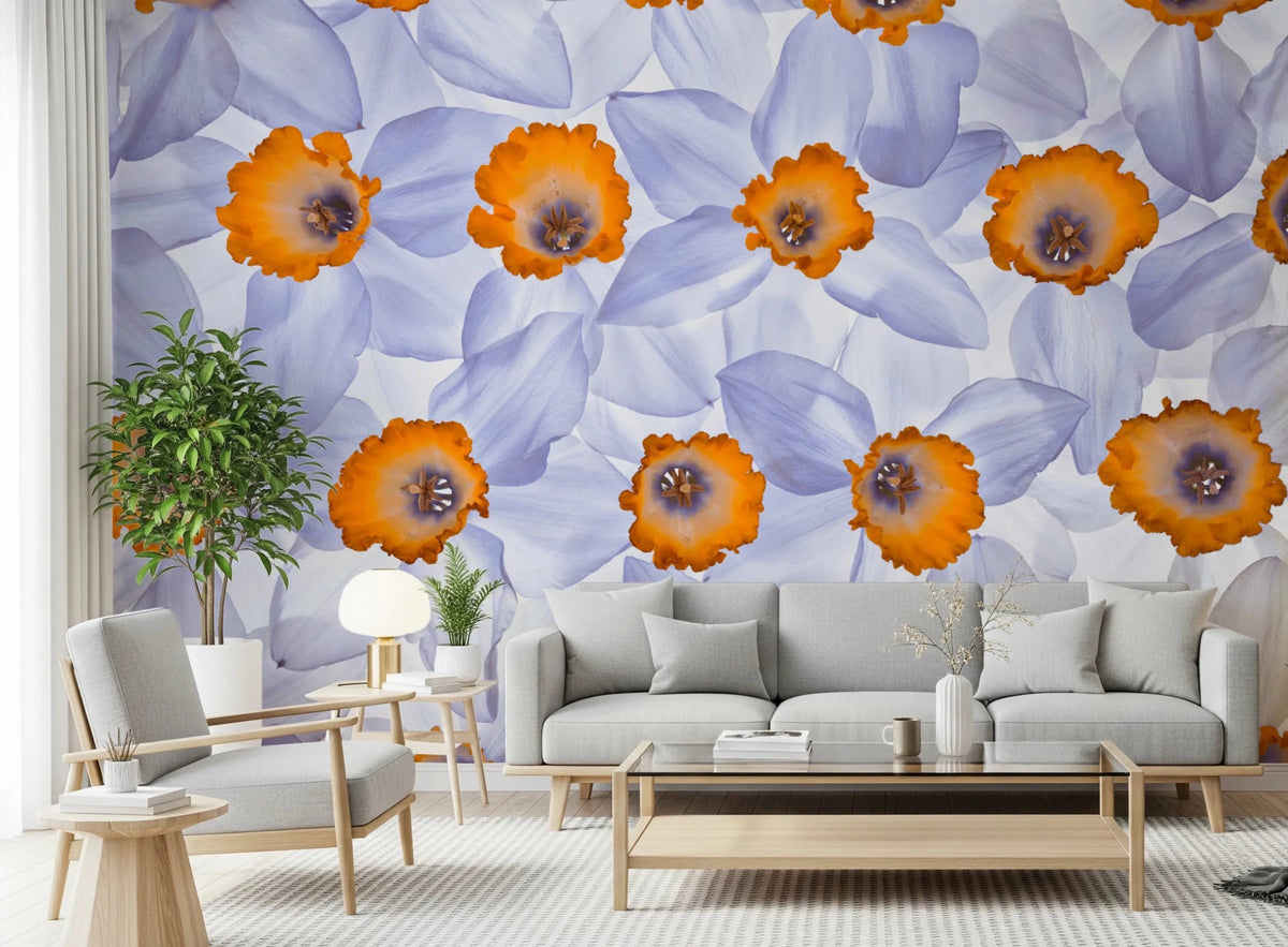 Daffodil Dreams wall mural of lilac and orange daffodils behind a grey sofa and wood-frame armchair with a ficus tree