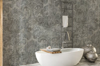 Damask wallpaper as a feature wall in a home office workspace in gray tones