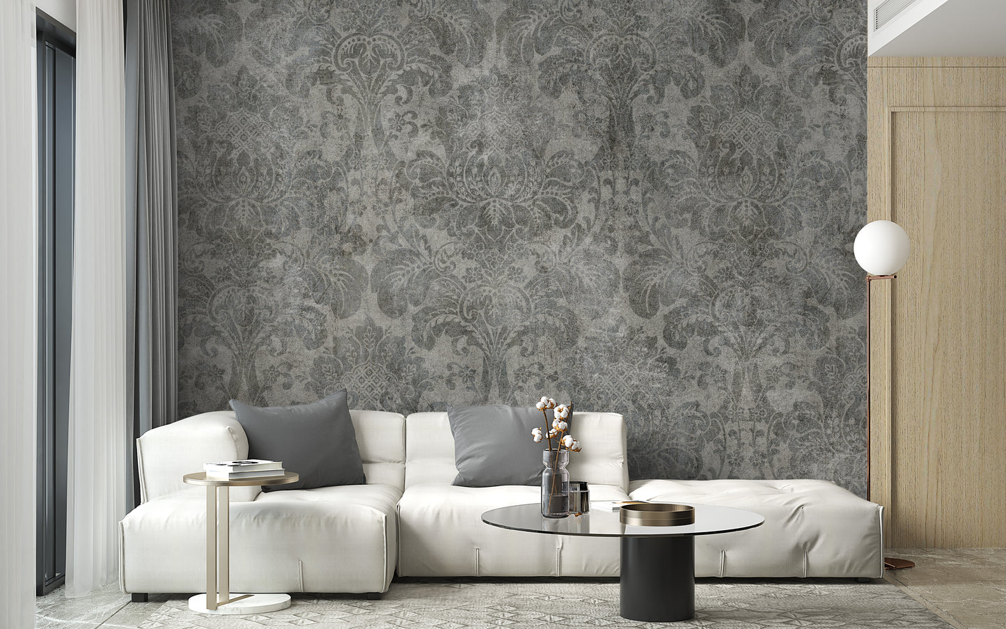 Damask wallpaper styled as a feature wall behind a dining table and chairs in gray tones