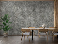 Damask wallpaper as a bedroom feature wall behind the headboard in gray tones