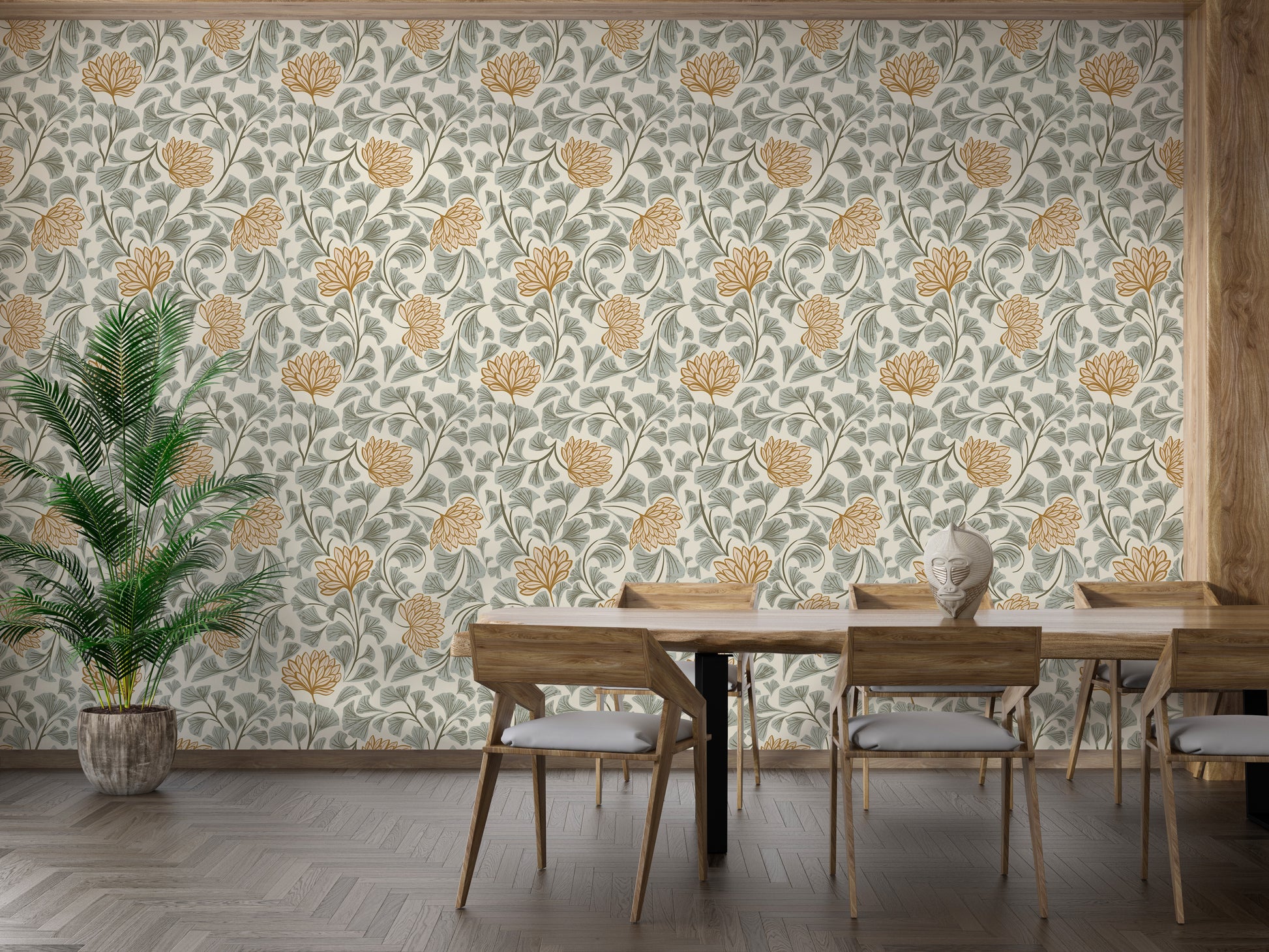 Dancing Bloom wallpaper with cream and ochre flowers behind a wood dining table and potted palm in a dining room