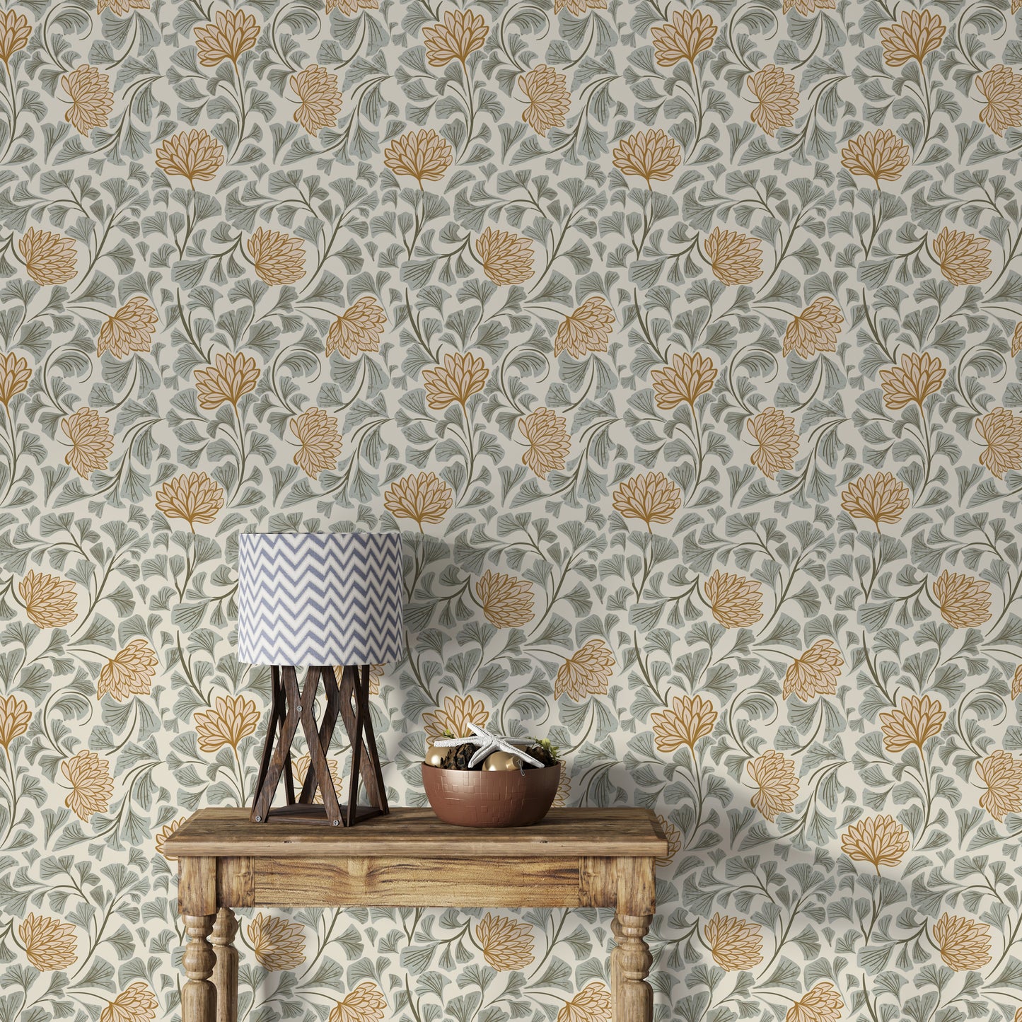 Dancing Bloom wallpaper in grey and amber florals behind a wood console table with a chevron-shade lamp and bowl