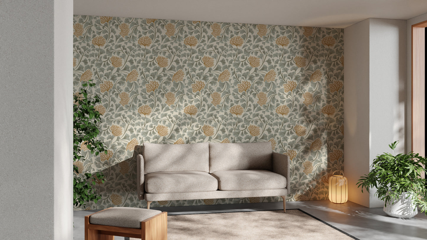 Dancing Bloom wallpaper with mustard florals and green leaves behind a beige sofa and lantern in a sunlit living room