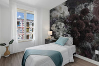 Dark Floral wallpaper mural as an accent wall behind a white bed with a teal throw in a bright bedroom