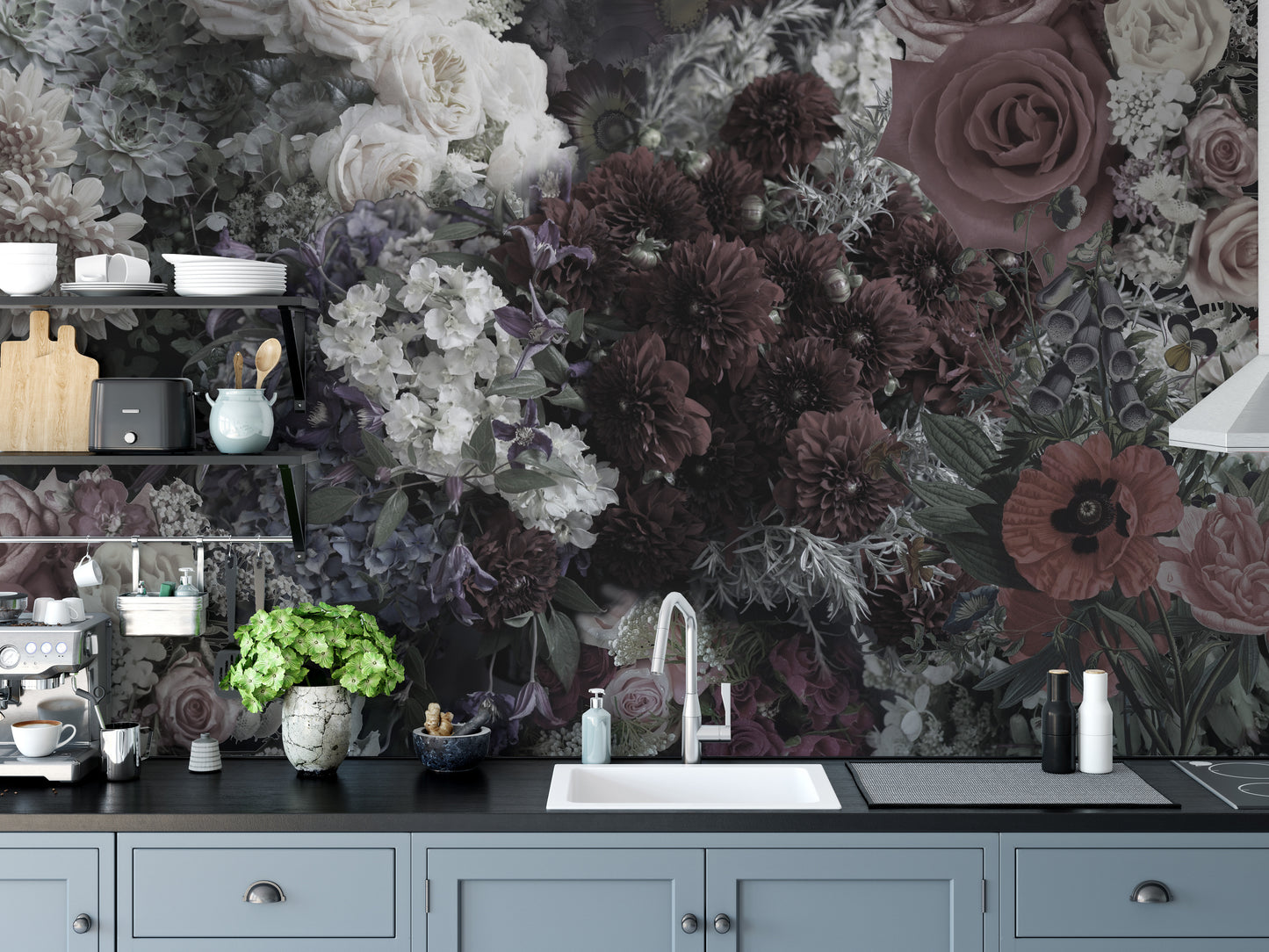 Dark Floral wallpaper mural above blue-grey cabinets and a white sink in a moody kitchen with dark blooms