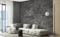 Dark Grey Brick Textured wallpaper mural styled along a hallway feature wall near a console in black tones