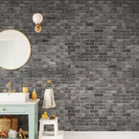 Dark Grey Brick Textured wallpaper mural as a feature wall in a home office workspace in black tones