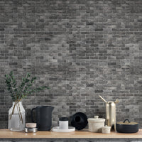 Dark Grey Brick Textured wallpaper mural as a bedroom feature wall behind the headboard in black tones