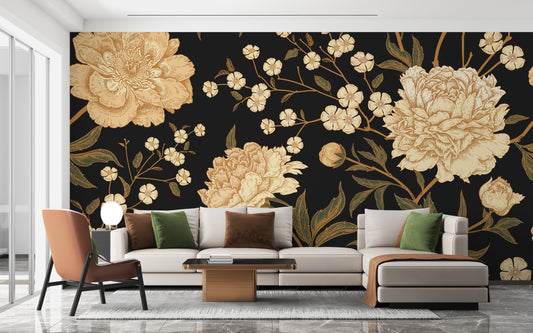 Dark Peony Flowers wallpaper mural with golden peonies on black behind a cream sofa and rust armchair in a living room