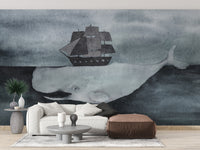 Dark Watercolor Whale design with Ship wallpaper mural styled along a hallway feature wall near a console in gray tones