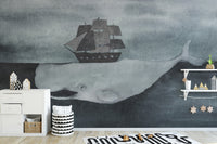 Dark Watercolor Whale design with Ship wallpaper mural styled as a feature wall behind a dining table and chairs