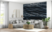 Wall mural with abstract ripple textures evoking serene ocean movements.