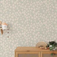 Dewy Birch Branches wallpaper in a kids room with a cane sideboard, rainbow stacker and mushroom shelf