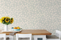 Dewy Birch Branches wallpaper in a dining room with a wood table, white chairs and sunflowers in a vase