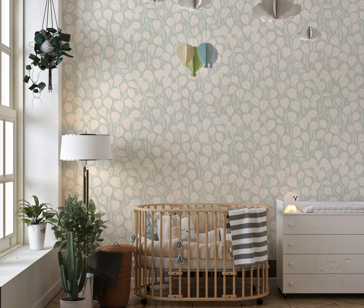 Dewy Birch Branches wallpaper in a nursery with a round wood crib, floor lamp and cloud mobile