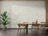 Dewy Birch Branches wallpaper in a dining room with a wood table, wood chairs and a tall areca palm