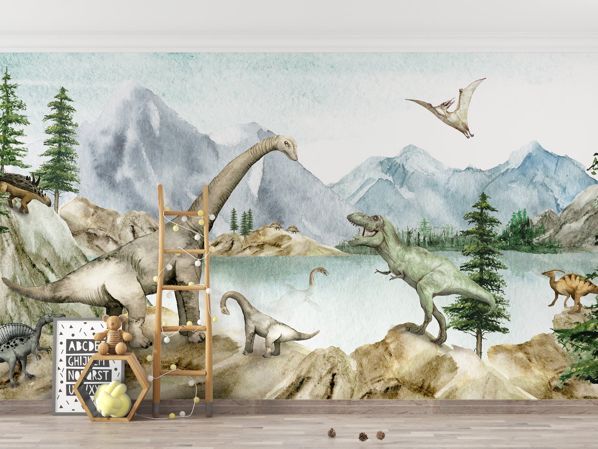 Dino dreams wallpaper mural of green watercolor dinosaurs by a lake above a kids room with a ladder and teddy bear
